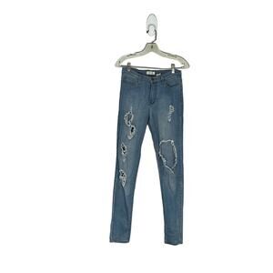 Skinny, medium wash, high waisted blue jeans with holes and distressed style